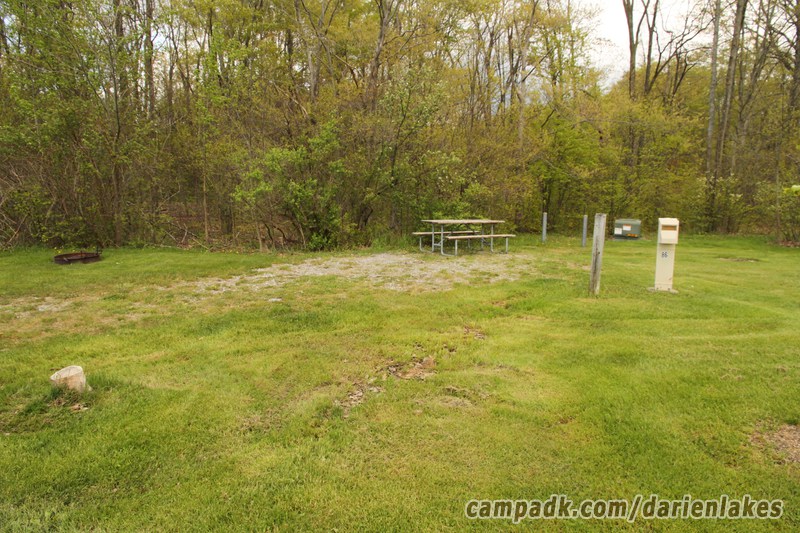 Campsite Photo of Site 86 at Darien Lakes State Park, New York - Looking at Site from Road Sign Visible