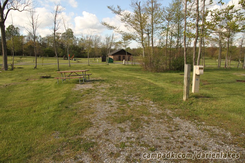 Campsite Photo of Site 156 at Darien Lakes State Park, New York - Looking at Site from Road Sign Visible