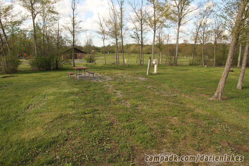 Campsite Photo of Site 136 at Darien Lakes State Park, New York - Looking at Site from Road Sign Visible