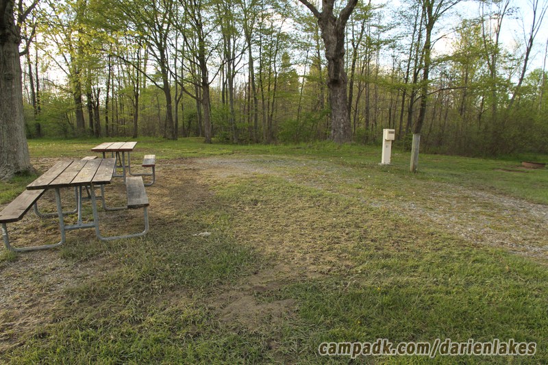 Campsite Photo of Site 61 at Darien Lakes State Park, New York - Looking at Site from Road Sign Visible