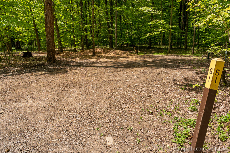 Campsite Photo of Site 61 at Delta Lake State Park, New York - Looking at Site from Road Sign Visible