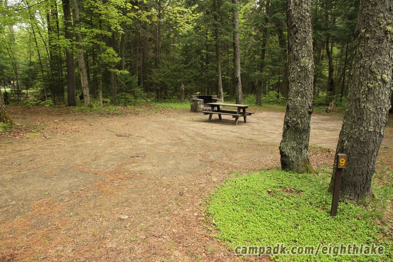 Campsite Photo of Site 9 at Eighth Lake Campground, New York - Looking at Site from Road Sign Visible