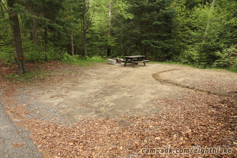 Campsite Photo of Site 120 at Eighth Lake Campground, New York - Looking at Site from Road Sign Visible