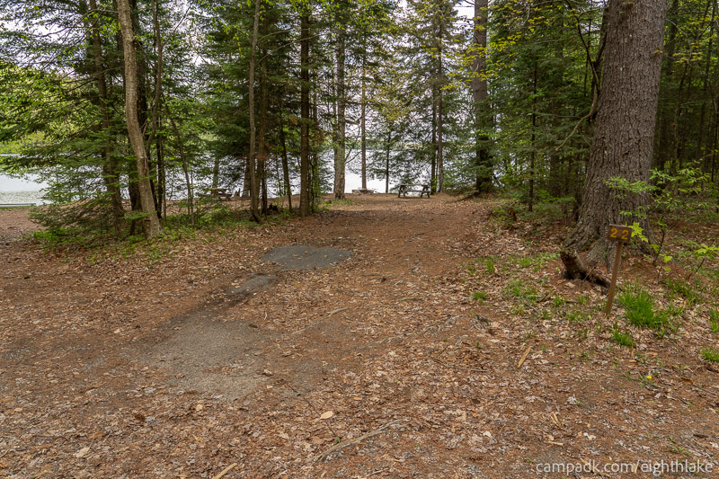 Campsite Photo of Site 22 at Eighth Lake Campground, New York - Looking at Site from Road Sign Visible