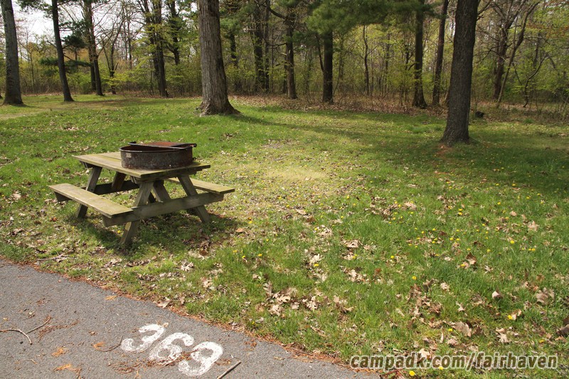 Campsite Photo of Site 369 at Fair Haven Beach State Park, New York - Looking at Site from Road Sign Visible