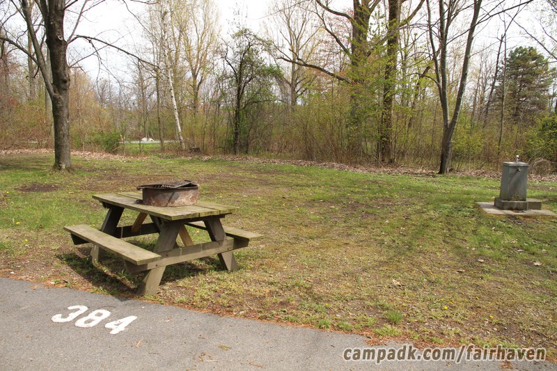 Campsite Photo of Site 384 at Fair Haven Beach State Park, New York - Looking at Site from Road Sign Visible