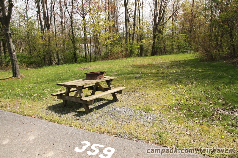 Campsite Photo of Site 359 at Fair Haven Beach State Park, New York - Looking at Site from Road Sign Visible