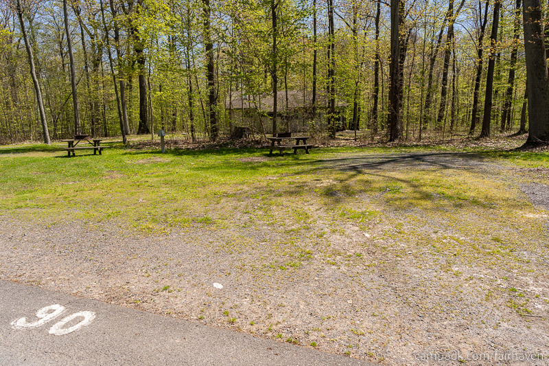 Campsite Photo of Site 90 at Fair Haven Beach State Park, New York - Looking at Site from Road Sign Visible