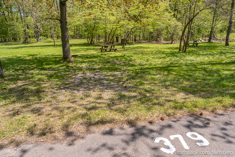 Campsite Photo of Site 379 at Fair Haven Beach State Park, New York - Looking at Site from Road Sign Visible