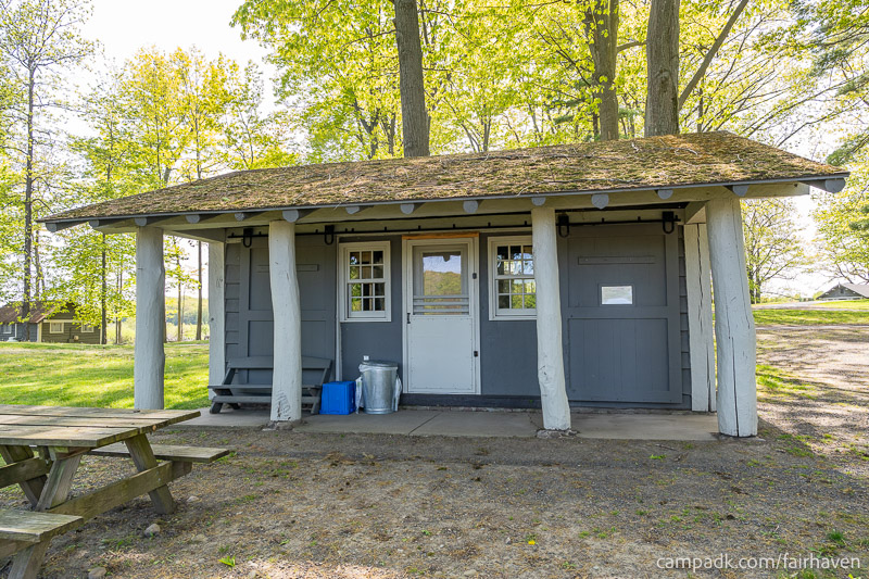 Campsite Photo of Site 26 at Fair Haven Beach State Park, New York - Looking at Site from Road Sign Visible