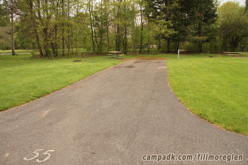 Campsite Photo of Site 55 at Fillmore Glen State Park, New York - Looking at Site from Road Sign Visible
