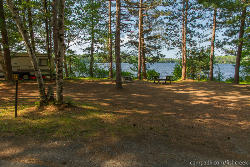 Campsite Photo of Site 116 at Fish Creek Pond Campground, New York - Looking at Site from Road Sign Visible