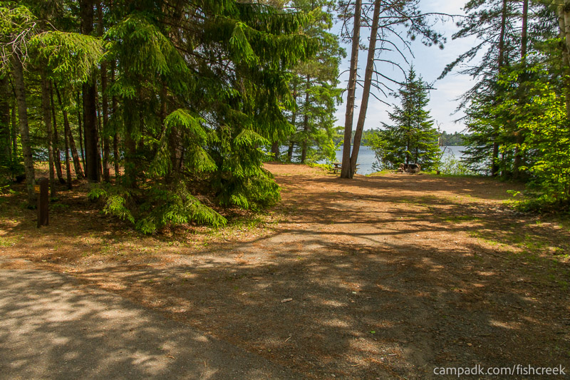 Campsite Photo of Site 175 at Fish Creek Pond Campground, New York - Looking at Site from Road Sign Visible