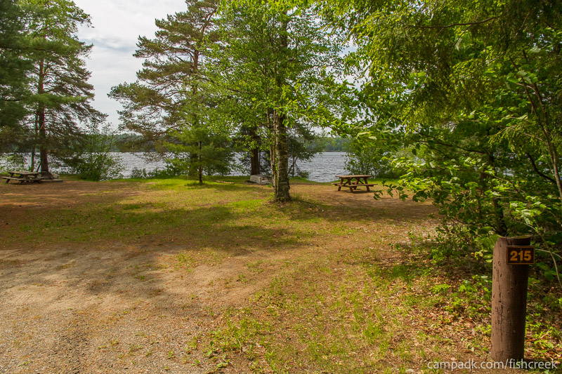 Campsite Photo of Site 243 at Fish Creek Pond Campground, New York - Looking at Site from Road Sign Visible