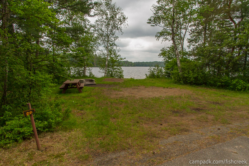 Campsite Photo of Site 92 at Fish Creek Pond Campground, New York - Looking at Site from Road Sign Visible