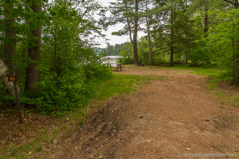 Campsite Photo of Site 89 at Fish Creek Pond Campground, New York - Looking at Site from Road Sign Visible