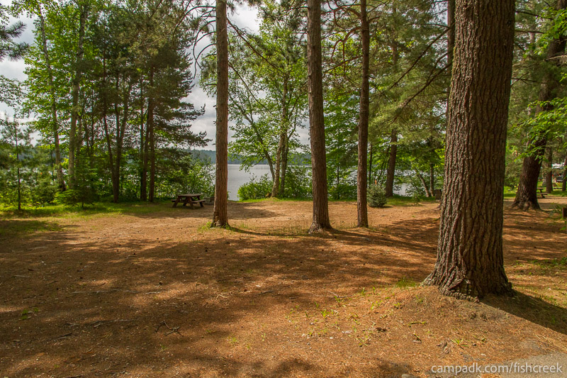 Campsite Photo of Site 47 at Fish Creek Pond Campground, New York - Looking at Site from Road Sign Visible