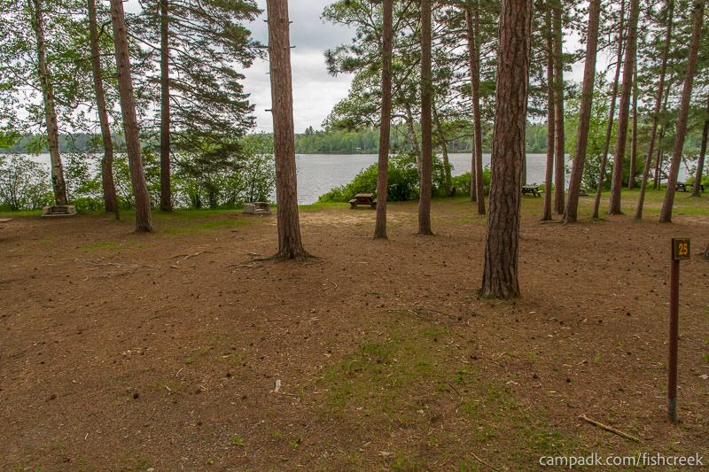 Campsite Photo of Site 27 at Fish Creek Pond Campground, New York - Looking at Site from Road Sign Visible