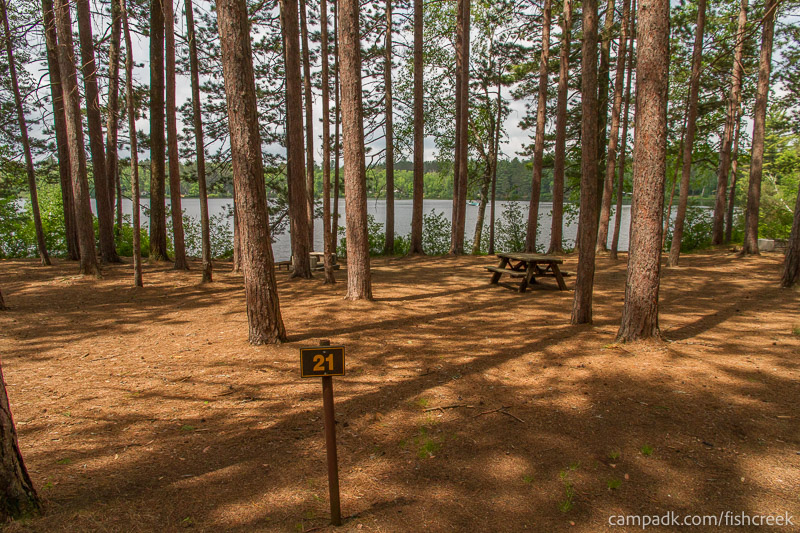 Campsite Photo of Site 18 at Fish Creek Pond Campground, New York - Looking at Site from Road Sign Visible