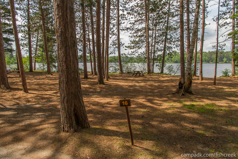 Campsite Photo of Site 13 at Fish Creek Pond Campground, New York - Looking at Site from Road Sign Visible