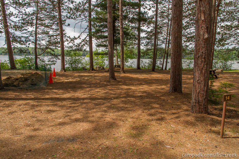 Campsite Photo of Site 11 at Fish Creek Pond Campground, New York - Looking at Site from Road Sign Visible