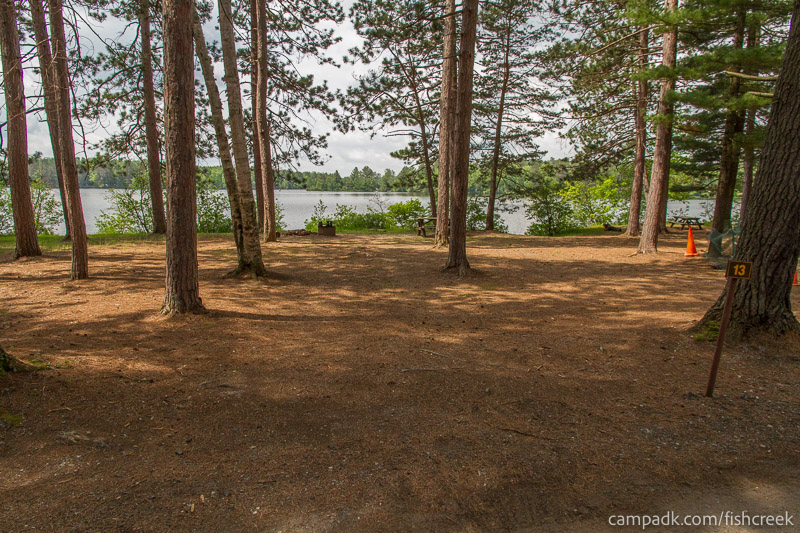 Campsite Photo of Site 10 at Fish Creek Pond Campground, New York - Looking at Site from Road Sign Visible