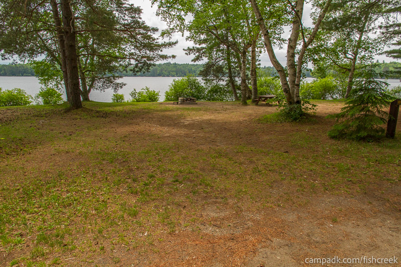 Campsite Photo of Site 137 at Fish Creek Pond Campground, New York - Looking at Site from Road Sign Visible