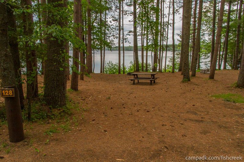 Campsite Photo of Site 160 at Fish Creek Pond Campground, New York - Looking at Site from Road Sign Visible