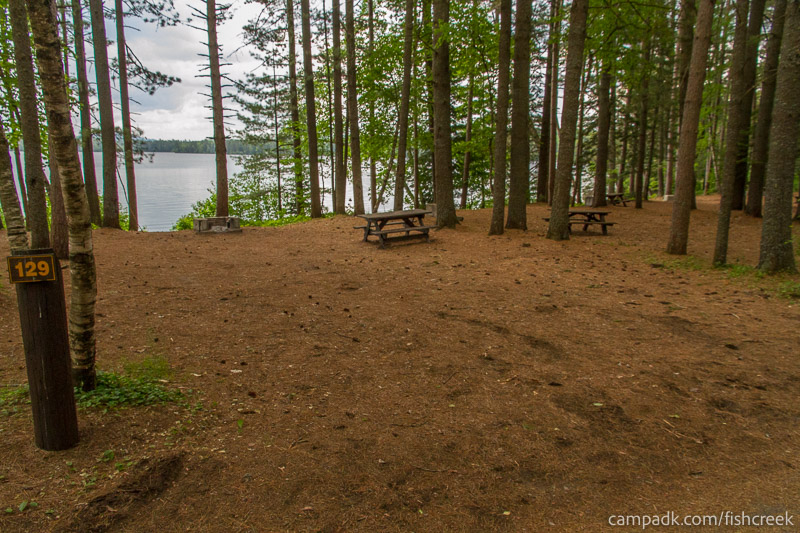 Campsite Photo of Site 161 at Fish Creek Pond Campground, New York - Looking at Site from Road Sign Visible