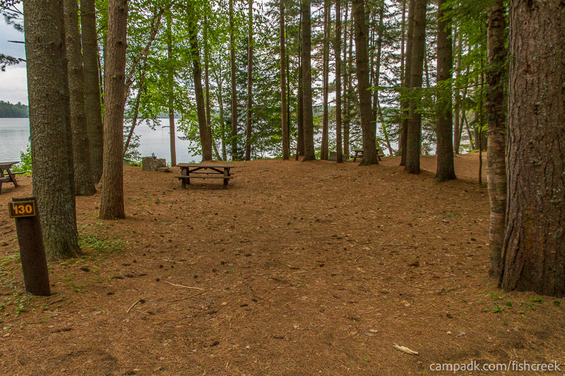 Campsite Photo of Site 162 at Fish Creek Pond Campground, New York - Looking at Site from Road Sign Visible