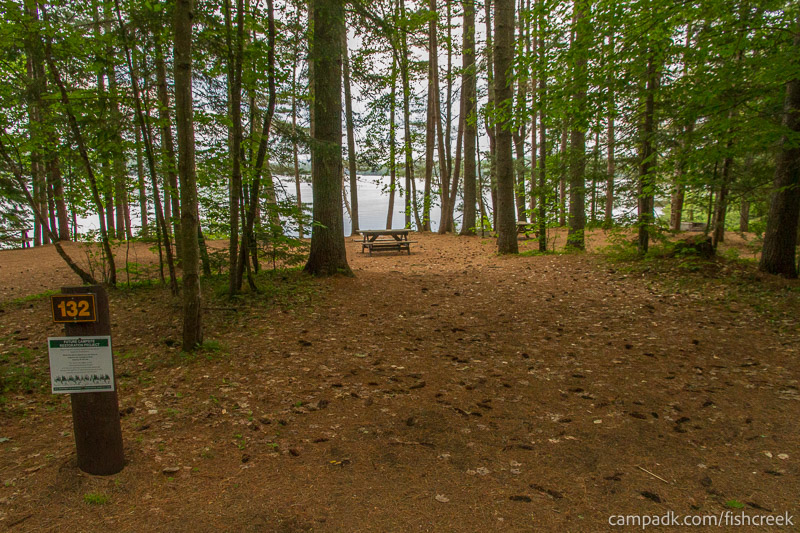 Campsite Photo of Site 164 at Fish Creek Pond Campground, New York - Looking at Site from Road Sign Visible