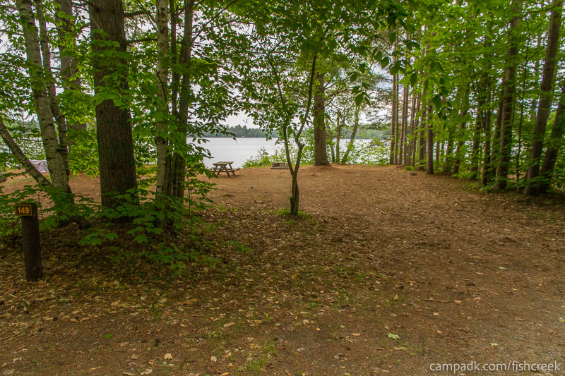 Campsite Photo of Site 179 at Fish Creek Pond Campground, New York - Looking at Site from Road Sign Visible
