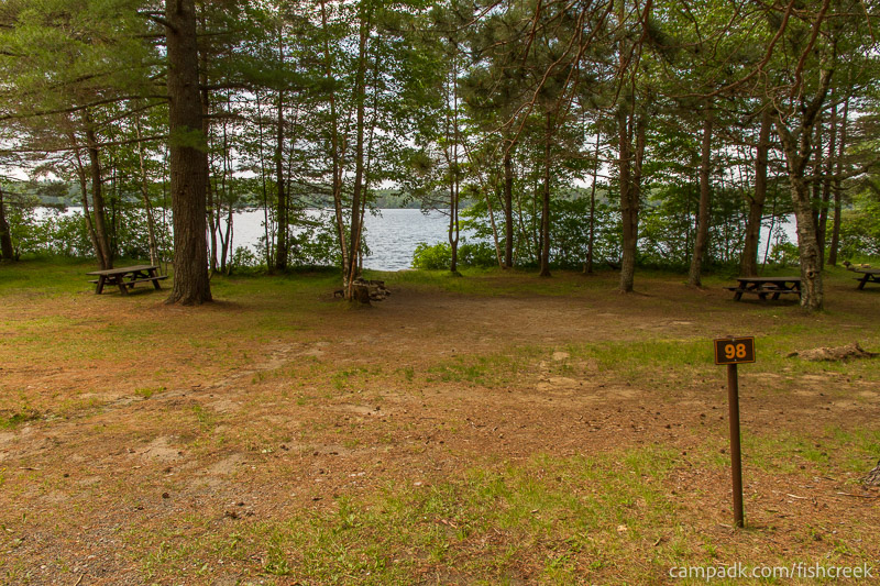 Campsite Photo of Site 130 at Fish Creek Pond Campground, New York - Looking at Site from Road Sign Visible