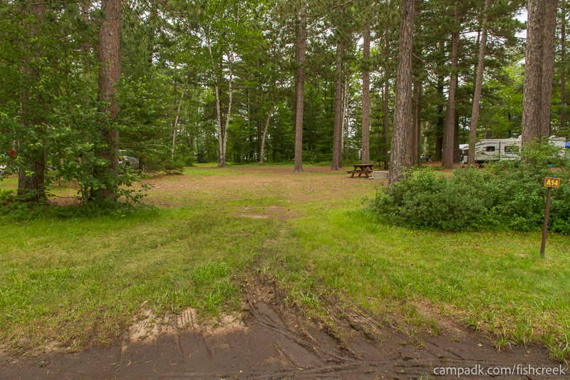 Campsite Photo of Site 94 at Fish Creek Pond Campground, New York - Looking at Site from Road Sign Visible