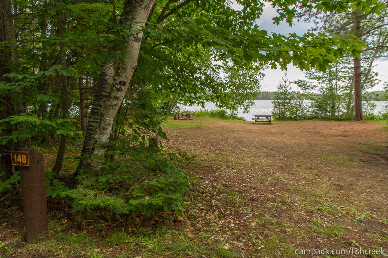 Campsite Photo of Site 178 at Fish Creek Pond Campground, New York - Looking at Site from Road Sign Visible