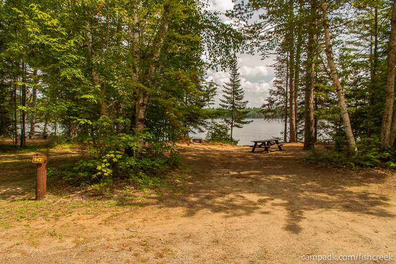 Campsite Photo of Site 172 at Fish Creek Pond Campground, New York - Looking at Site from Road Sign Visible