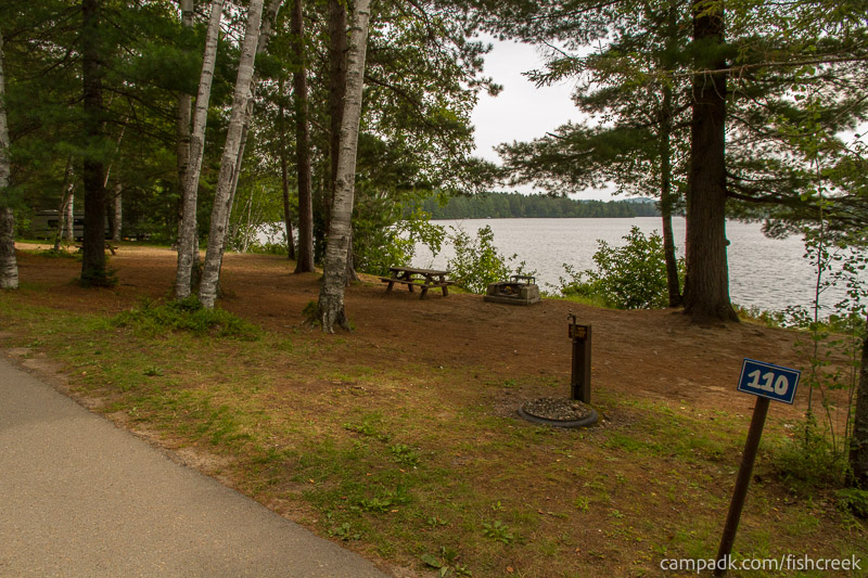 Campsite Photo of Site 142 at Fish Creek Pond Campground, New York - Looking at Site from Road Sign Visible
