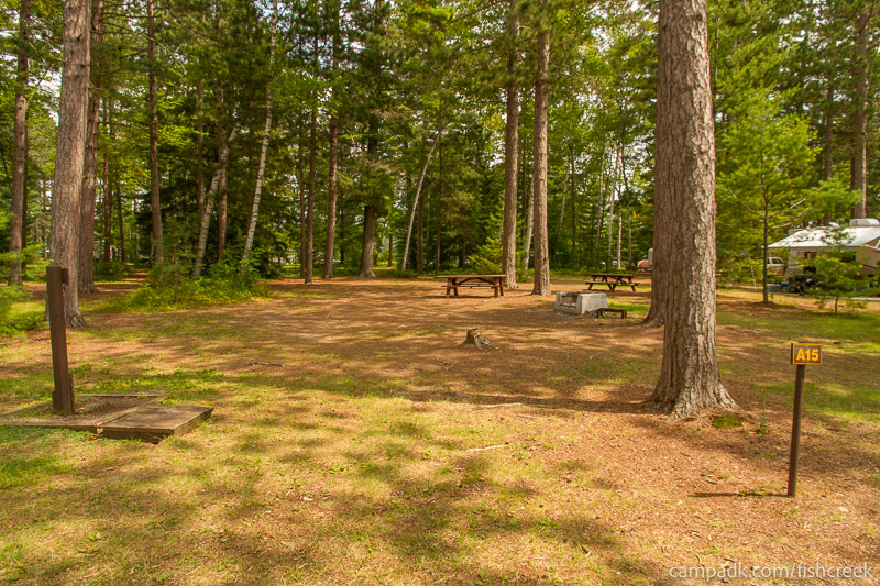 Campsite Photo of Site 96 at Fish Creek Pond Campground, New York - Looking at Site from Road Sign Visible