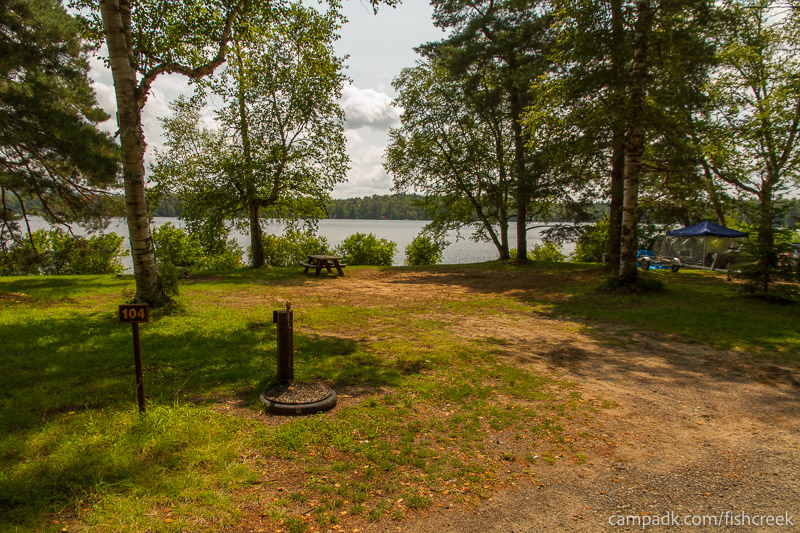 Campsite Photo of Site 136 at Fish Creek Pond Campground, New York - Looking at Site from Road Sign Visible
