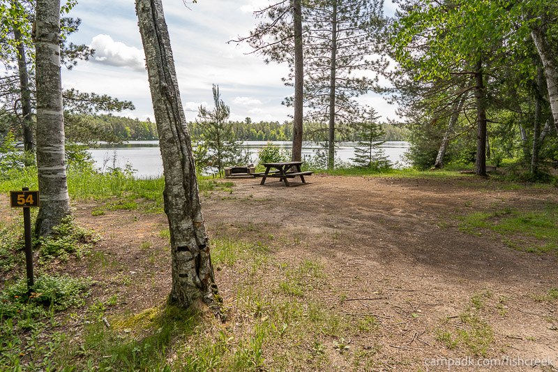 Campsite Photo of Site 65 at Fish Creek Pond Campground, New York - Looking at Site from Road Sign Visible