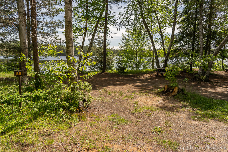 Campsite Photo of Site 67 at Fish Creek Pond Campground, New York - Looking at Site from Road Sign Visible