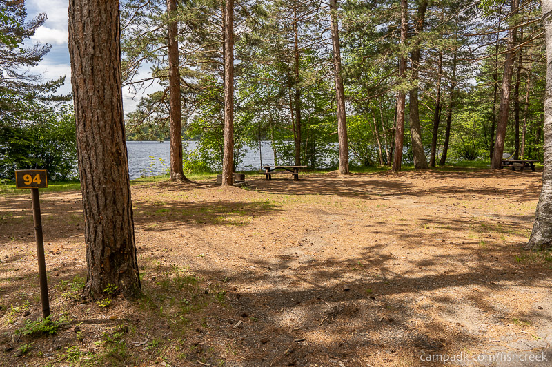 Campsite Photo of Site 126 at Fish Creek Pond Campground, New York - Looking at Site from Road Sign Visible