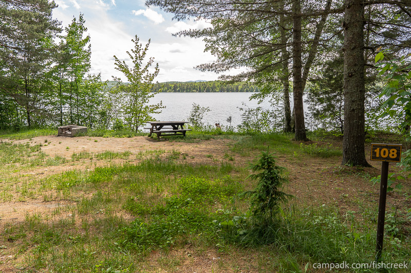 Campsite Photo of Site 140 at Fish Creek Pond Campground, New York - Looking at Site from Road Sign Visible