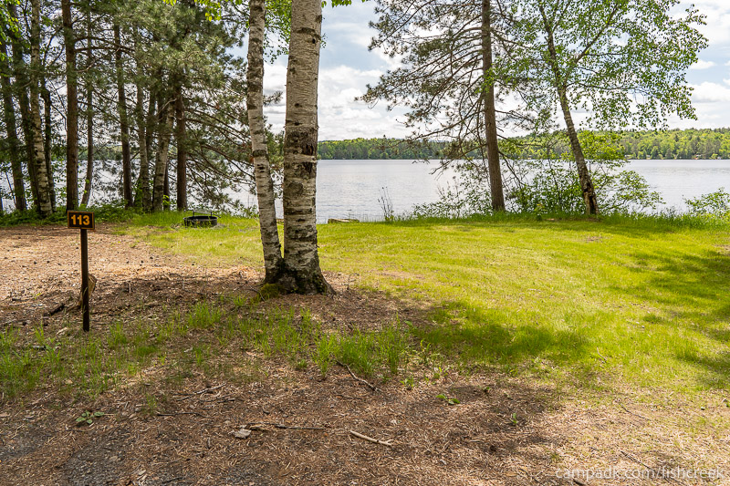 Campsite Photo of Site 145 at Fish Creek Pond Campground, New York - Looking at Site from Road Sign Visible