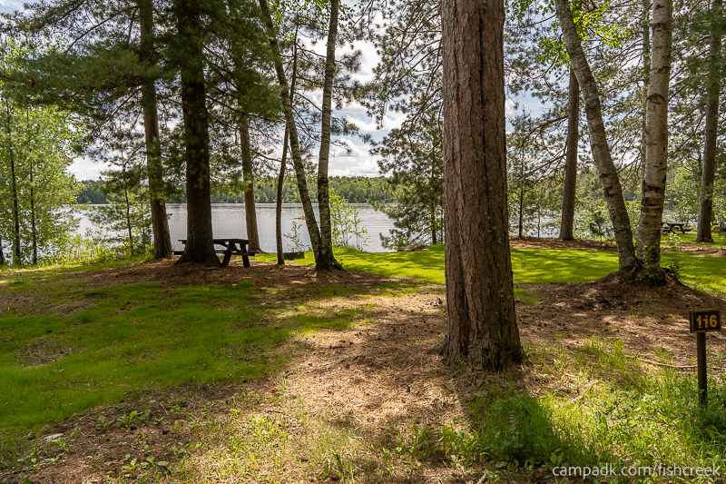 Campsite Photo of Site 148 at Fish Creek Pond Campground, New York - Looking at Site from Road Sign Visible