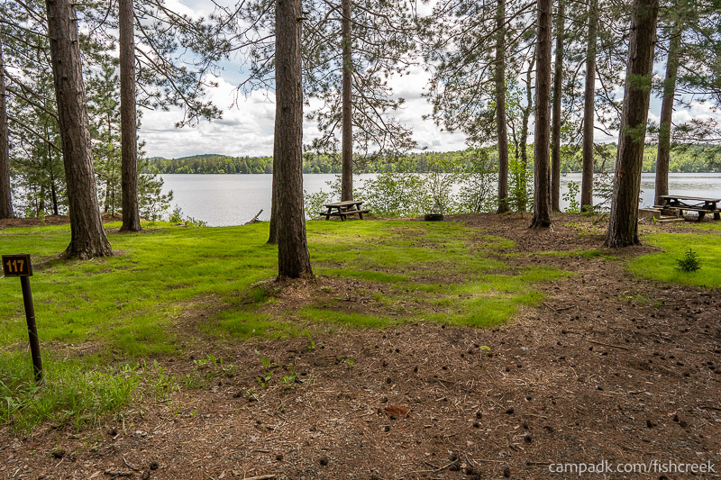 Campsite Photo of Site 149 at Fish Creek Pond Campground, New York - Looking at Site from Road Sign Visible