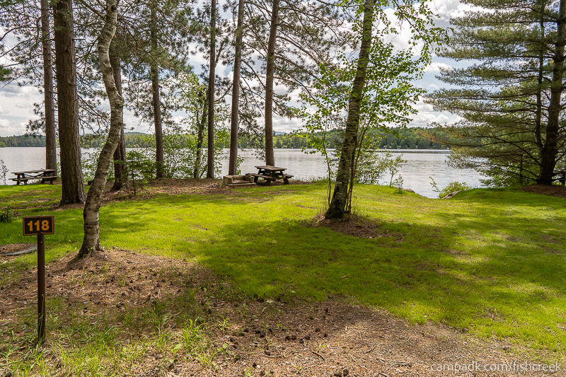 Campsite Photo of Site 150 at Fish Creek Pond Campground, New York - Looking at Site from Road Sign Visible