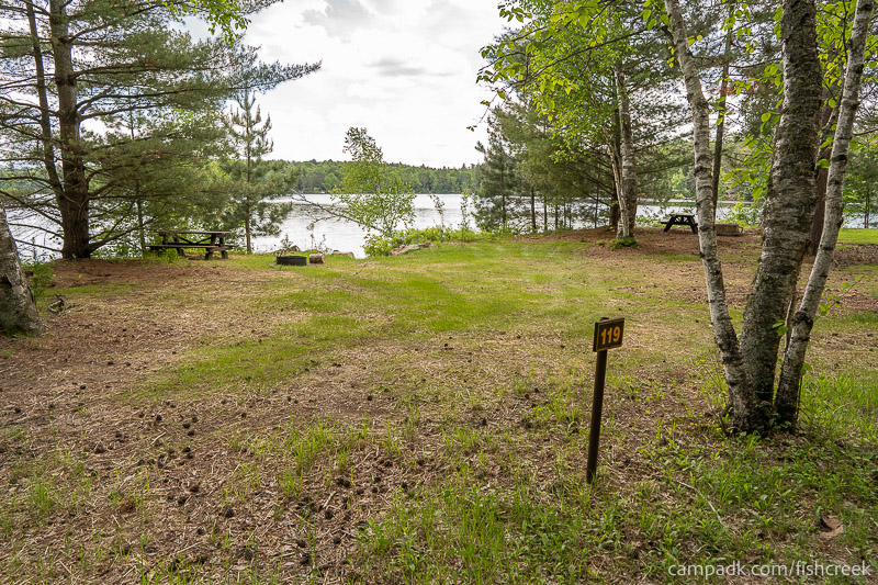 Campsite Photo of Site 151 at Fish Creek Pond Campground, New York - Looking at Site from Road Sign Visible