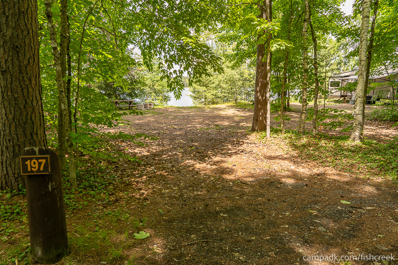 Campsite Photo of Site 225 at Fish Creek Pond Campground, New York - Looking at Site from Road Sign Visible