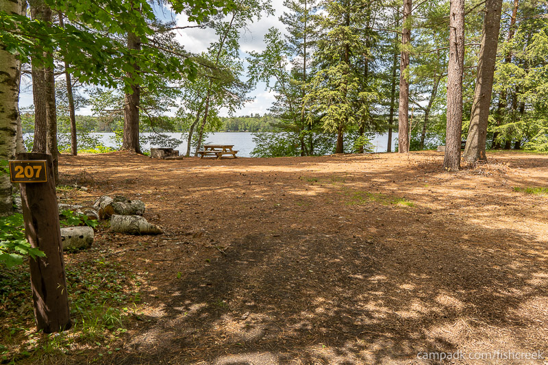 Campsite Photo of Site 235 at Fish Creek Pond Campground, New York - Looking at Site from Road Sign Visible